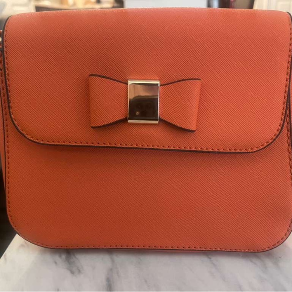 Elegant Orange Crossbody Bag with Bow Accent